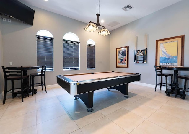 rec room featuring light tile patterned floors, baseboards, and visible vents