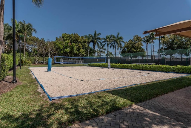 view of property's community with volleyball court and fence