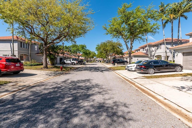 view of street with curbs and a residential view