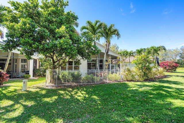 view of yard with a sunroom