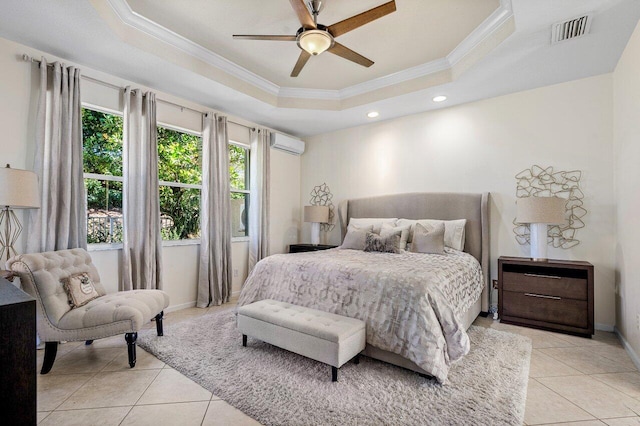 bedroom featuring a tray ceiling, an AC wall unit, visible vents, and light tile patterned floors