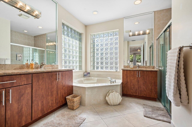 bathroom featuring a stall shower, tile patterned flooring, visible vents, and a healthy amount of sunlight