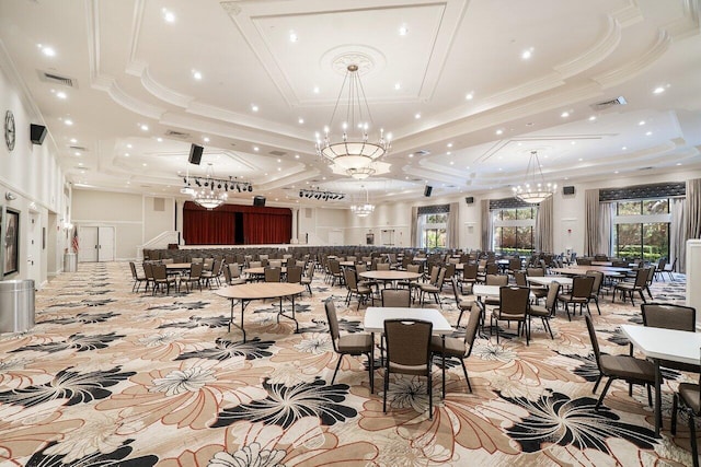 dining room featuring a tray ceiling, visible vents, a chandelier, and crown molding