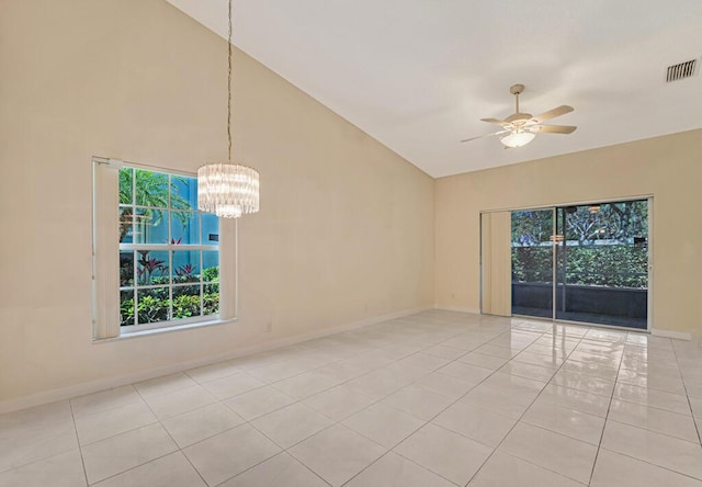 unfurnished room with light tile patterned floors, baseboards, visible vents, high vaulted ceiling, and ceiling fan with notable chandelier