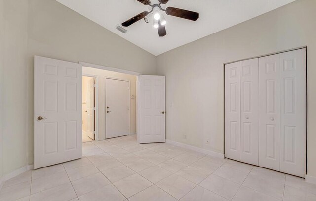 bathroom with tile patterned flooring, vanity, toilet, and bath / shower combo with glass door