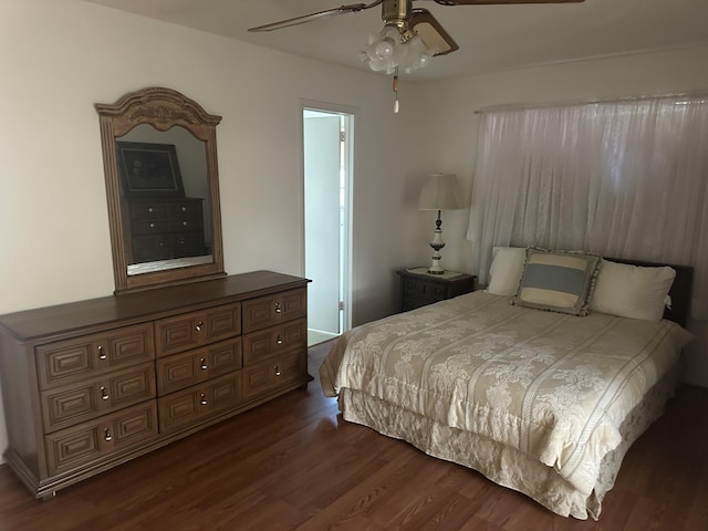 bedroom featuring dark wood-style flooring and ceiling fan