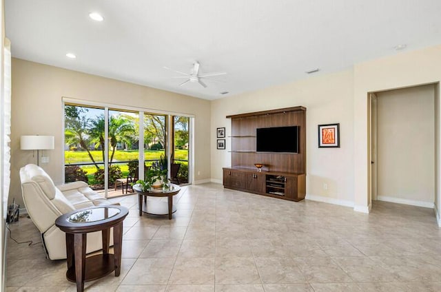 living room featuring light tile patterned floors, recessed lighting, baseboards, and ceiling fan