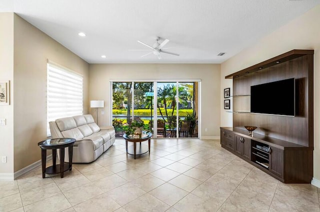 living room with a ceiling fan, visible vents, baseboards, light tile patterned flooring, and recessed lighting