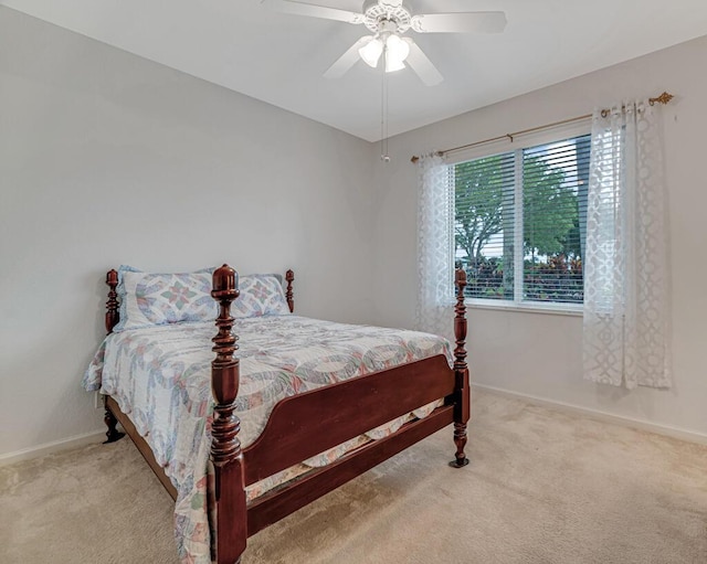bedroom featuring ceiling fan, carpet flooring, and baseboards