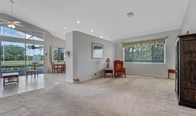 living area with light carpet, visible vents, ceiling fan, vaulted ceiling, and recessed lighting