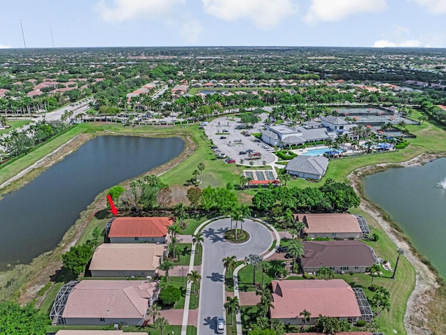 bird's eye view featuring a water view and a residential view