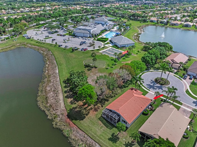 birds eye view of property with a water view and a residential view