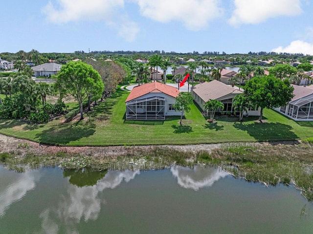 birds eye view of property featuring a water view and a residential view