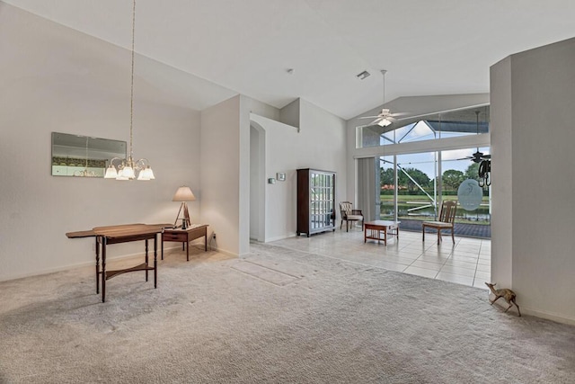 interior space with baseboards, ceiling fan, tile patterned floors, high vaulted ceiling, and carpet floors