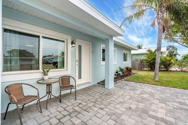 view of patio / terrace featuring fence