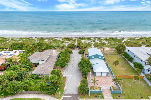 bird's eye view featuring a water view and a view of the beach