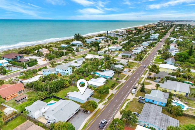 birds eye view of property featuring a water view and a residential view