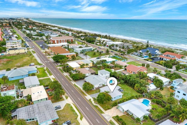 birds eye view of property with a residential view and a water view