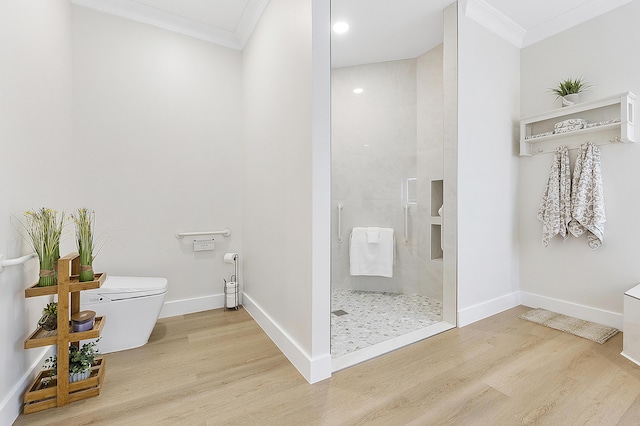 full bath featuring toilet, crown molding, and wood finished floors