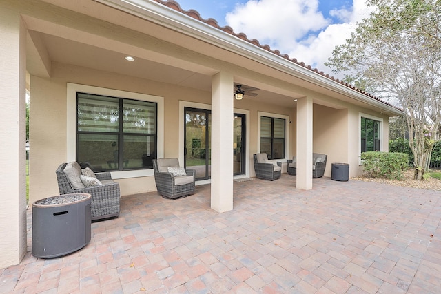 view of patio / terrace featuring an outdoor living space and ceiling fan