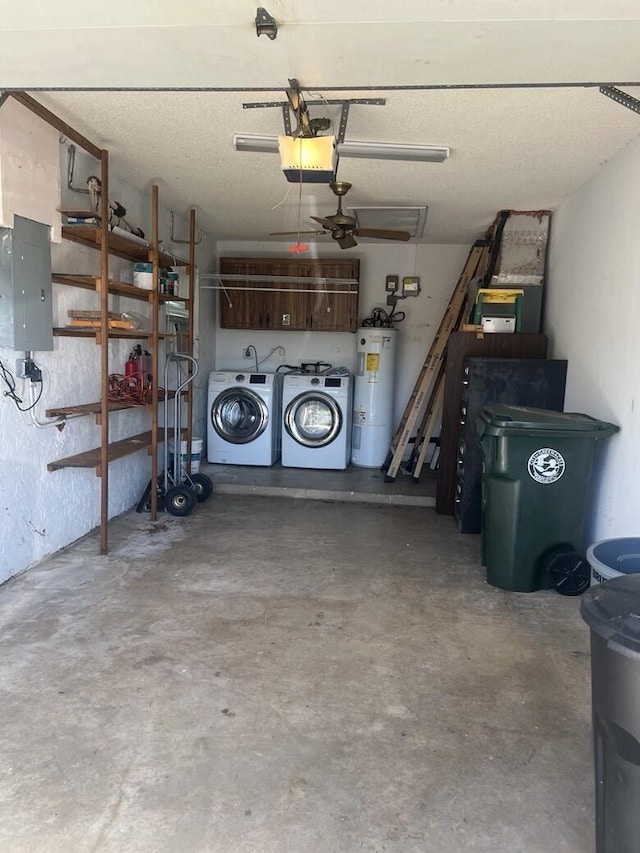 garage with electric panel, washer and clothes dryer, electric water heater, and a garage door opener