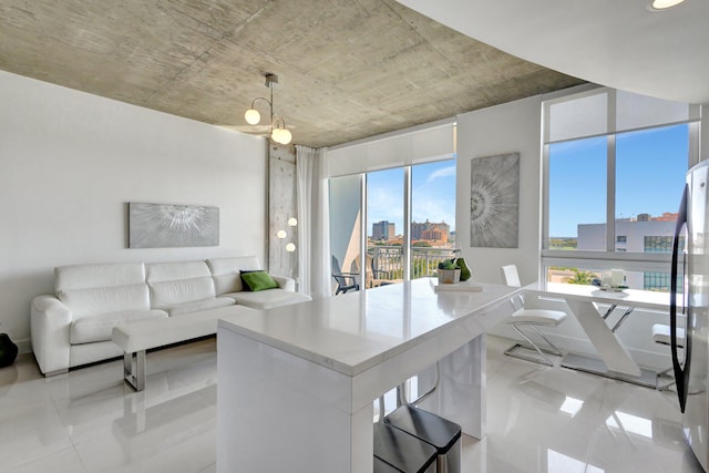 living area featuring light tile patterned floors and a view of city