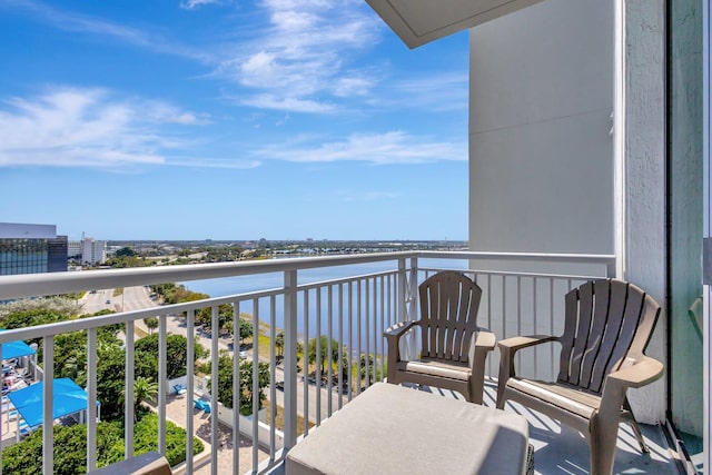 balcony featuring a water view