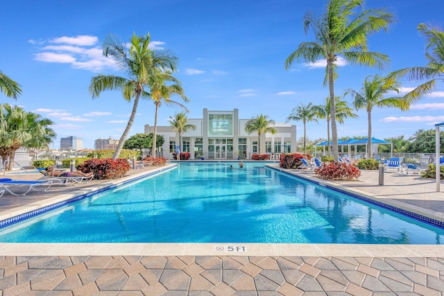 pool featuring a patio area and fence