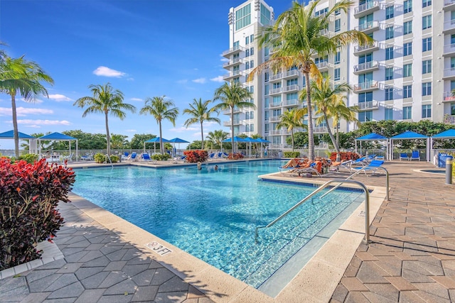 pool featuring a patio area and fence