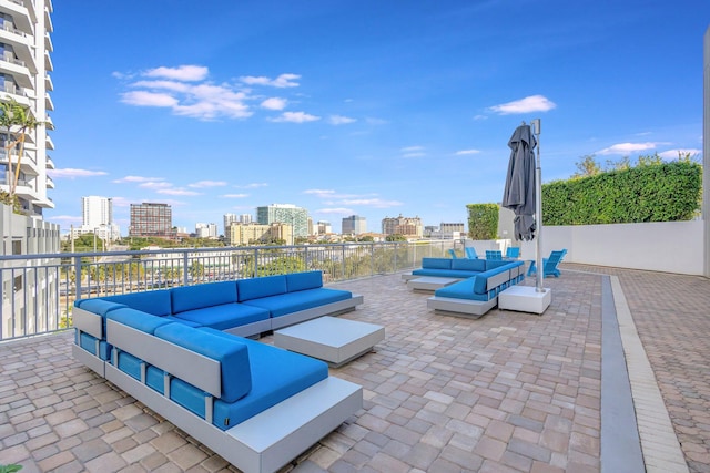 view of patio / terrace with an outdoor hangout area and a city view