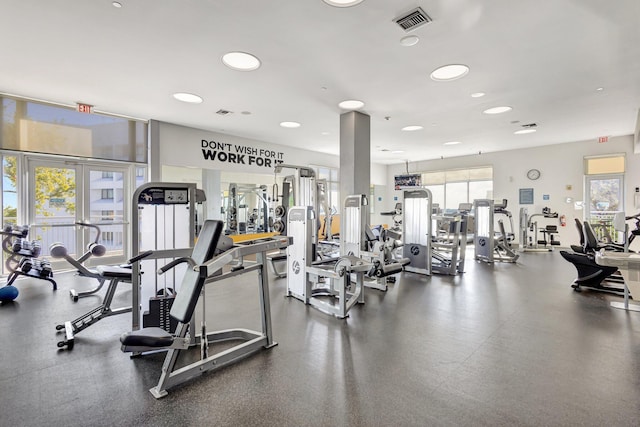 exercise room featuring visible vents and french doors