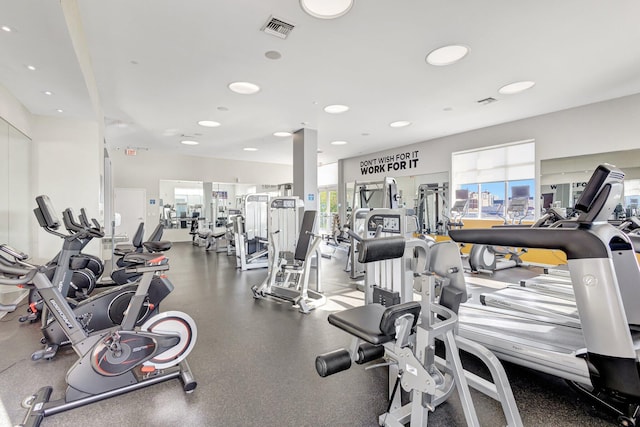 gym with plenty of natural light, recessed lighting, and visible vents