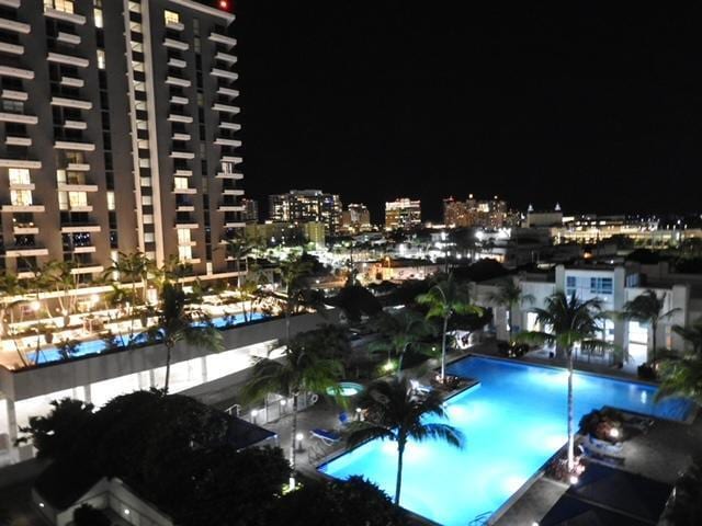 pool at night with a view of city lights