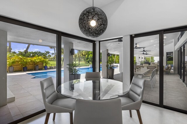 view of patio / terrace featuring a fenced in pool, fence, outdoor dining area, ceiling fan, and outdoor lounge area