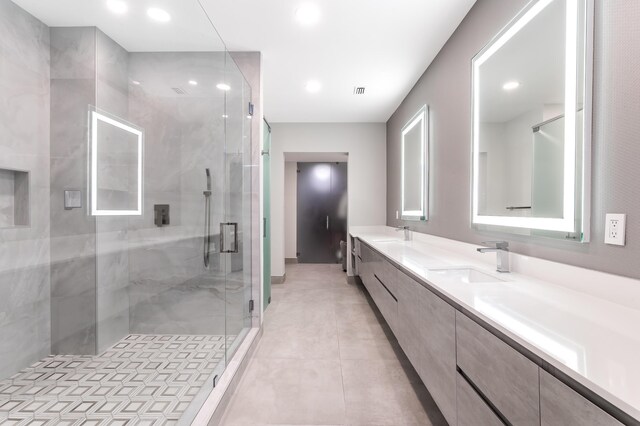 bathroom featuring vanity, toilet, and tiled shower