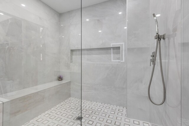 full bath featuring vanity and a shower stall