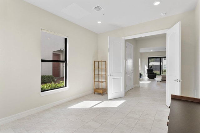 spare room with baseboards, visible vents, recessed lighting, and light tile patterned floors