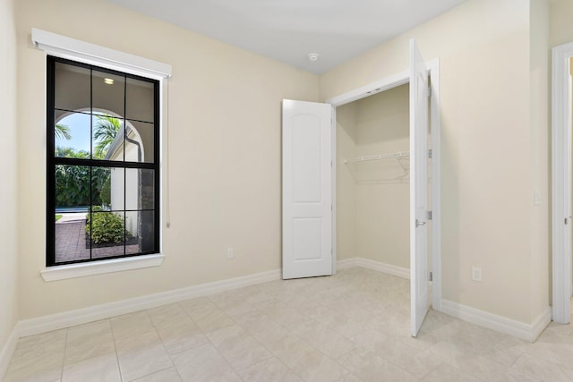 unfurnished bedroom with baseboards