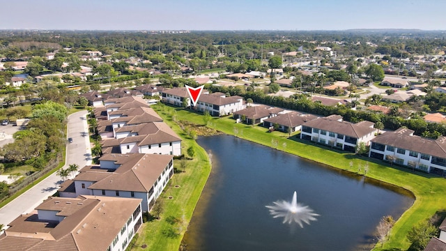 bird's eye view with a water view and a residential view