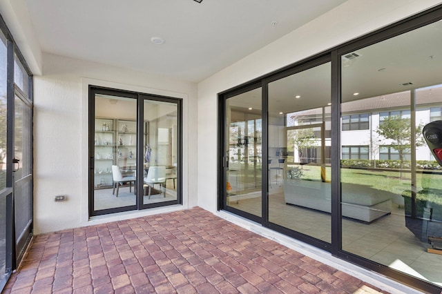 unfurnished sunroom featuring visible vents