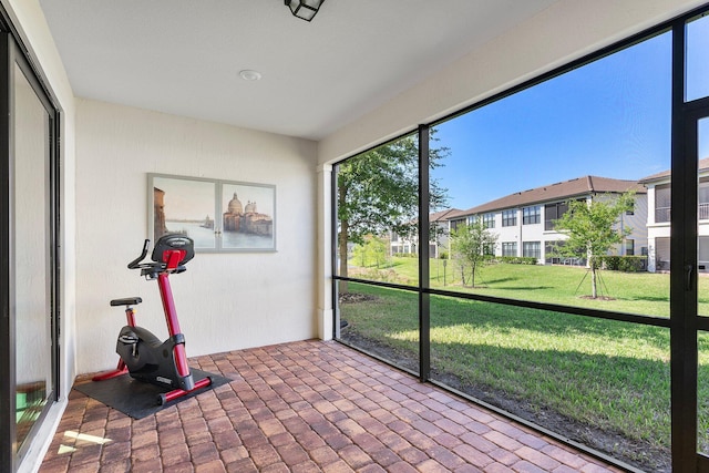 unfurnished sunroom with a residential view