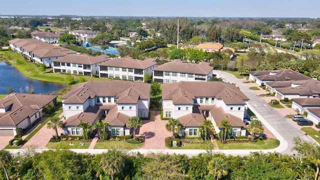 birds eye view of property with a residential view and a water view