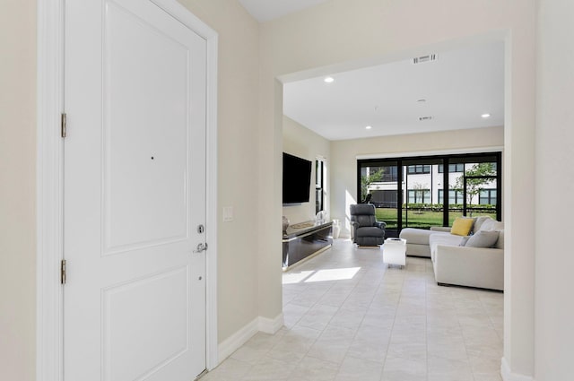 living room with recessed lighting, baseboards, and visible vents