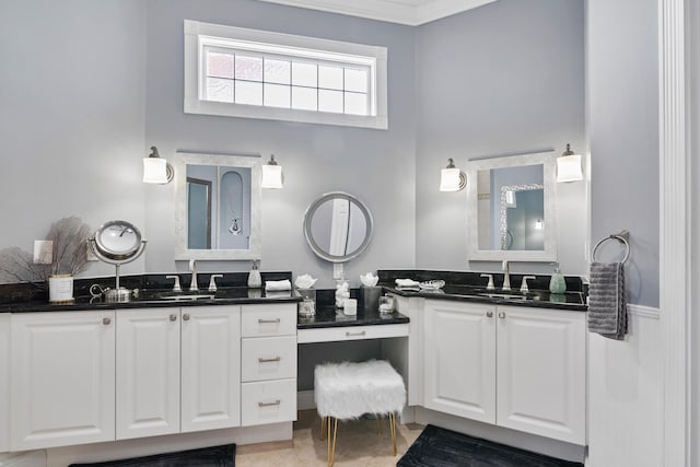 bathroom with two vanities and a sink