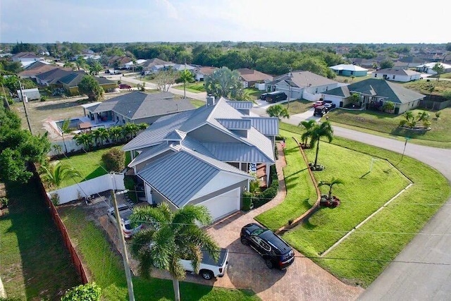 birds eye view of property with a residential view