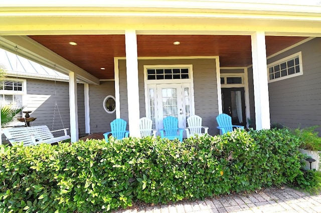 doorway to property featuring a porch