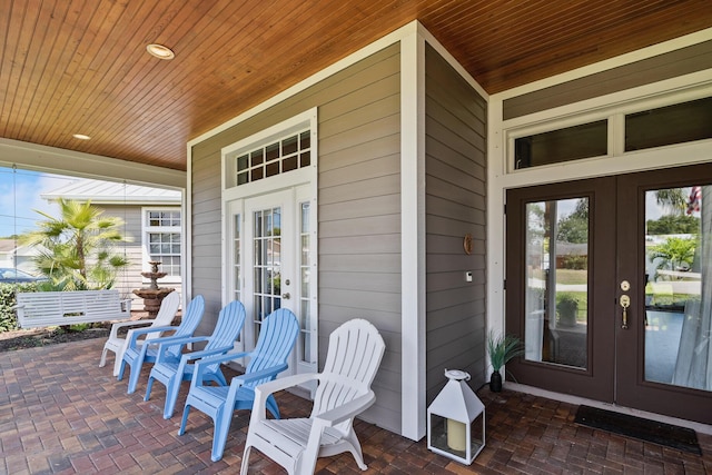 view of patio with a porch and french doors