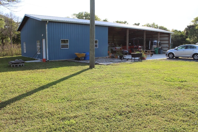 view of pole building with a lawn