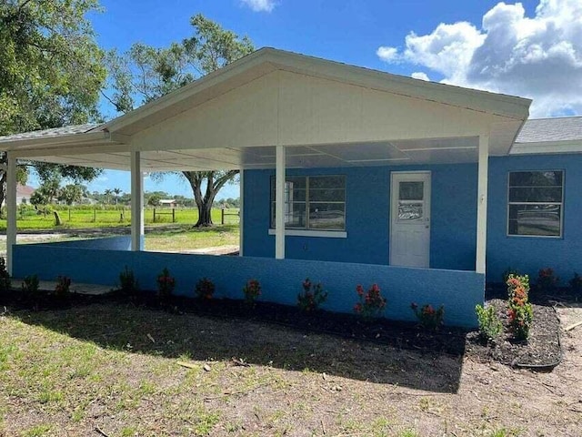 view of home's exterior with a carport