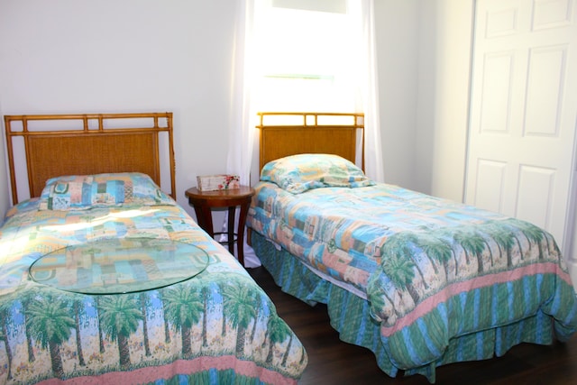 bedroom with wood finished floors